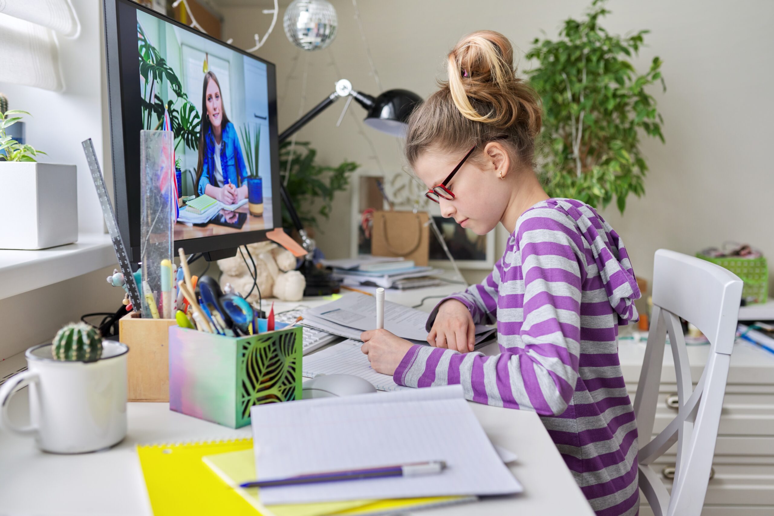 Middle school girl watching online class